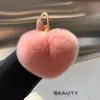 Chaveiro Pingente Coração de Pelúcia Imitação de Pelo de Coelho Decoração de Chave de Carro Presente Fofo em Formato de Coração para Mulheres