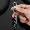 Llavero de aleación de plata de moda con incrustaciones de diamantes con forma de animal leopardo, colgante para coche y bolso, accesorio metálico creativo, venta al por mayor