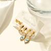 Aogu Europeos y Americanos Chapados en Oro de 18 Quilates Zirconia Goteo de Aceite Ojo del Diablo Acero de Titanio Pendientes para Mujer Set de Pendientes Elegantes de Nicho Nuevo