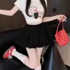 Falda floral pura y encantadora estilo ballet, un nuevo diseño de verano con cintura alta, una silueta A que estiliza y una longitud corta para evitar la exposición.