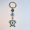 Colgante de Serie Ojo de Diablo Transfronterizo Europeo y Americano Colgante de Llavero de Joyería de Animales Ojo de Hueso con Goteo de Aceite Accesorios de Aleación para Mujeres