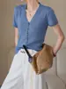 Cárdigan único de Tencel con botones y cuello en V, de tejido texturizado y transpirable, elegante chaqueta de manga corta para primavera y verano con un toque de alta gama