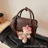 Moda Estilo Coreano Retro Bolso Cuadrado Pequeño para Mujer 2026 Nuevo Diseño Pequeño de Nicho Bolso de Mano Pequeño Bolso Cruzado Simple Versátil