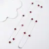 NK-283 trébol de cuatro hojas que gotea aceite 130 cm multicolor plegable cadena larga para suéter de mujer otoño e invierno nuevo venta al por mayor de fábrica