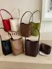 Bolsa com padrão trançado Shuai Mi Jia, bolsa feminina de estilo descontraído, bolsa de ombro única, bolsa de mão sob o braço elegante de alta moda estilo coreano