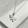 Collar con cadena en O de diseño de nicho color dorado con colgante de trébol de cuatro hojas de flor doble full-diamond, el más vendido de Amazon para mujer