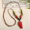 Collar con colgante de campana de mariposa de cerámica de estilo étnico retro para mujer, diseño nuevo y moderno, cadena larga para suéter, accesorios