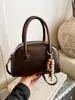 Bolso de Mano Nuevo de Gamuza Otoño e Invierno 2025 para Mujer Bolso Retro tipo Bowling Moderno Simple para el Trabajo Bolso de Hombro Cruzado
