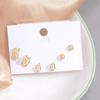 Brincos pequenos de cobre 18K com zircônia microincrustada um cartão três pares de combinação de terno moda alto senso transfronteiriço Europa e Estados Unidos quentes mulheres