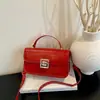 Bolso Cruzado de Hombro Pequeño Cuadrado Casual Elegante con Hebilla de Candado 2026 Nuevo Color Sólido Retro para Viajero de Negocios Gran Capacidad