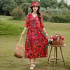 Vestido de algodão e seda brilhante e estiloso para viagem a Yunnan no início do verão de 2026, vestido de praia popular deste ano para mães, vestido longo esvoaçante