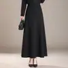Elegante y estiloso faldón de mujer para otoño e invierno 2026, con cintura alta, diseño favorecedor de línea A, corte holgado, tela fluida y un bajo largo y ancho