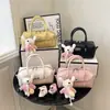 Diseño único, nueva colección de verano, bolso de hombro para mujer de color liso, versátil y elegante, perfecto para ir al trabajo, con un aspecto de alta gama y un toque de personalidad