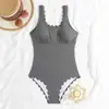 Traje de baño de una pieza de nuevo estilo para mujer, sexy, ajustado, color liso, simple, exportación europea y americana, sin espalda, traje de baño casual para aguas termales