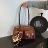 Bolso de Axila Retro de Nicho para Mujer Otoño e Invierno 2025 Nuevo Versátil Tendencia Coreana Bolso de Hombro Bolso de Bowling de Gran Capacidad