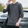 Temporada de primavera y otoño, camiseta lisa popular de manga larga, corte holgado, cuello redondo, unisex, top simple y versátil