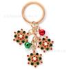 Llavero navideño de aleación con diseño de copo de nieve creativo, colgante de campana, regalo de Navidad, joyería transfronteriza europea y americana