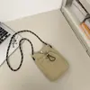 Bolsa de Celular Ins Cor Sólida Estilo Japonês 2026 Nova Bolsa Portátil de Mão com Alça Única Bolsa Transversal Elegante para Trabalho e Deslocamento para Mulheres