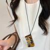 Collar retro de leopardo con peine, cadena larga para suéter, diseño de nicho para mujer, collar de ácido acético, accesorios de cuello con cuerda negra de alta gama