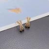 Aretes colgantes de borlas cruzadas de temperamento de estilo similar de alto sentido, aretes de borlas de viento frío de amor de nudo de doble uso