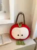 Bolsa de Tote de Peluche de Manzana Linda 2025 Nuevo Otoño e Invierno Nicho Versátil Bolso de Mano Dibujos Animados Gran Capacidad Bolso de Hombro