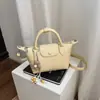 Bolso de Diseño Nicho Estilo Coreano Bolso Dumpling para Mujer 2026 Verano Nueva Moda Versátil Bolso de Hombro Cruzado Tote