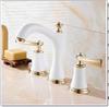 Grifo de baño retro de latón estilo europeo doble manija 360 giratorio tres orificios manija cruzada traje para lavabo, etc.
