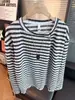 Camiseta de punto de manga larga con textura de rayas transfronteriza para hombre, diseño de tapeta diagonal, top versátil para primavera y otoño, capa base