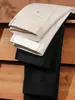 Jeans masculinos de algodão puro de alta qualidade para primavera e outono de 2026, corte reto, caimento solto, calças masculinas versáteis, calças compridas da moda e versáteis para homens de meia-idade