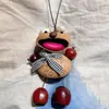 Encantador perrito peludo con la lengua fuera, llavero para bolso, colgante de dibujos animados natural, semillas de terapia de sonido curativas, popular en zonas escénicas, amuleto divertido y adorable