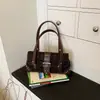 Bolso de axila de estilo coreano transfronterizo para mujer, nuevo bolso de hombro de moda nicho 2026, bolso de mano casual personalizado retro