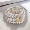 Itens Mais Vendidos Transfronteiriços: Pulseira com Pingente de Coração em Liga de Metal Estilo Boho, Pulseira Elástica de Contas Multicamadas