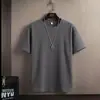 2026 Verano Nuevo de Moda Sencillo Top de Manga Corta para Hombre Holgado Casual Versátil Color Sólido Fresco Camiseta de Cuello Redondo