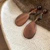 Brincos retrô em formato de concha de madeira estilo étnico, design único e de nicho, atacado de brincos e acessórios de orelha distintos e individuais