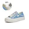 Zapatos de lona de dos vías para mujer, nuevo lanzamiento otoño 2026, zapatos planos casuales tipo galleta, zapatos blancos versátiles de moda, zapatos cómodos para mujer