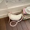 Bolsa croissant de nicho estilo francês para mulheres, novo modelo 2024, bolsa de bolinho simples e versátil, bolsa de ombro e transversal moderna e estilosa