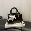 2026 Verano Nueva Moda Elegante Texturizado Simple Diseño de Nicho Versátil Bolso de Hombro Cruzado Pequeño Cuadrado