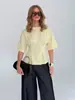 Camiseta de mujer de manga media con cuello redondo, corte ajustado, cintura ceñida y dobladillo con volantes, versátil y elegante, superventas transfronteriza europea y americana