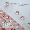 Nuevos diamantes de imitación para uñas K9 color durazno, temática de flor de cerezo, con gradiente translúcido, forma de flor aurora, base puntiaguda y un efecto brillante y translúcido