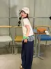 Ropa Infantil Floral y Xun Pantalones Largos para Niña 2026 Verano Nuevo Estilo Coreano Cuadros Falso Dos Piezas Versátil para Superponer Moderno