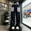 Jeans reto com bolso frontal em blocos de cor xadrez retrô americano para homens, calça larga solta, calça longa de design de nicho da moda