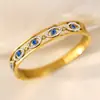 Venta al por mayor transfronteriza del fabricante Oro de 18 quilates de alta gama Incrustado de diamantes Acero de titanio para mujer Joyería que no se decolora Pulsera de acero de titanio Ojo del diablo