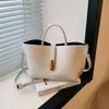 Bolsa de mão vintage estilo francês para mulheres, novo modelo verão 2025, bolsa de ombro e transversal para o trabalho, bolsa tote simples de cor sólida