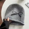 Gorro Soltinho Estilo Coreano Retrô com Laço de Tricô Chapéu Frio para Mulheres, Novo Outono/Inverno Quente e à Prova de Frio Protetor de Orelhas Touca de Cabeça