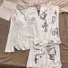 Nuevo conjunto de pijama de manga larga acanalado de seda helada con almohadillas en el pecho para mujer, nuevo estilo de primavera y otoño, conjunto de ropa para el hogar de gato perezoso