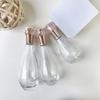 Botella de vidrio dorada rosa para traje de bolos botella con pulverizador de presión de 150 ml botella de loción de 100 ml/60 ml botella de crema facial de 50 g