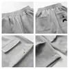 Pantalones Cortos Anchos Estilo Ropa de Trabajo con Bordado de Letras Estrelladas y Múltiples Bolsillos para Hombre, Pantalones Casuales Sueltos Estilo Americano Nuevos para Primavera/Verano para Mujer, Modernos