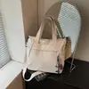 Bolso de Hombro Casual Minimalista Blanco Leche con Múltiples Bolsillos y un Toque Artístico para Estudiantes Universitarias, Adecuado para Viajes Matutinos, Viajes y Compras