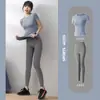 Conjunto de Ropa de Yoga sin Costuras Europea y Americana para Mujer, Camiseta Deportiva de Manga Corta para Fitness, Pantalones de Tiro Alto tipo Durazno para Levantar Glúteos, Conjunto Deportivo para Gimnasio y Running