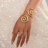 Moda europea y americana personalidad moda espiral Xiangyun pulsera anillo conjunto adecuado para ropa de fiesta de mujer